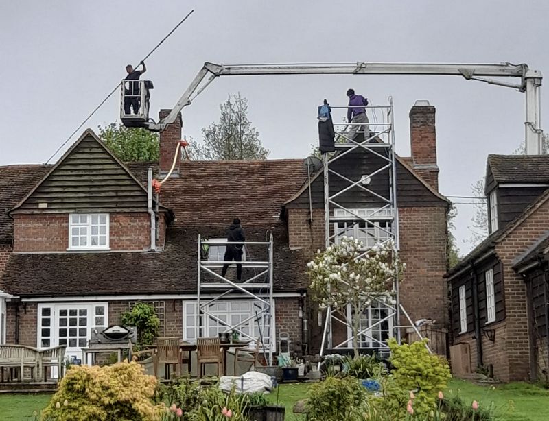 The Roof Moss Cleaners using cherry picker and scaffolding to clean roof safely and professionally in March, Cambridgeshire