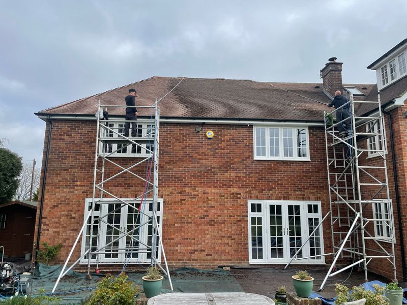 Roof cleaning carried out safely from scaffold towers by The Roof Moss Cleaners in March